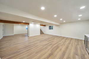 Basement featuring light hardwood / wood-style floors