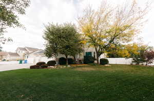 View of yard featuring a garage