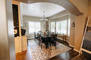 Dining space with chandelier and lots of natural light