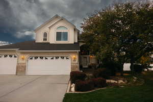 View of front of property featuring a garage