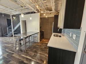 Custom Kitchen with glass cabinets and tile backsplash! All stainless steel appliances!