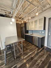 Custom Kitchen with glass cabinets and tile backsplash! All stainless steel appliances!