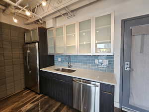 Custom Kitchen with glass cabinets and tile backsplash! All stainless steel appliances!