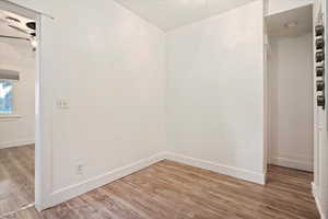 Spare room with wood-type flooring