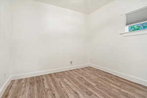 Empty room featuring light hardwood / wood-style flooring