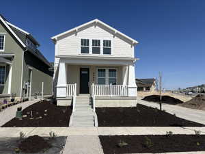 View of front of home featuring covered porch
