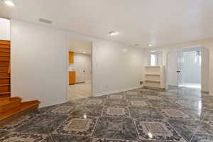 Unfurnished room featuring ceiling fan