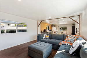 Living room with dark hardwood / wood-style floors