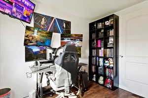 Bedroom/Office area featuring dark hardwood / wood-style flooring