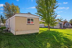 Exterior space with a yard and central AC unit