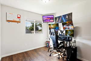 Bedroom/Office space featuring hardwood / wood-style floors