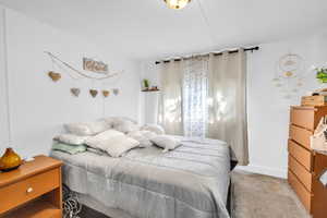 Bedroom featuring carpet flooring