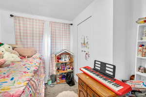 Bedroom featuring carpet