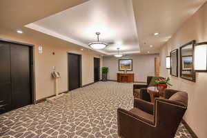 2nd floor exit off elevators leading to community amenities.