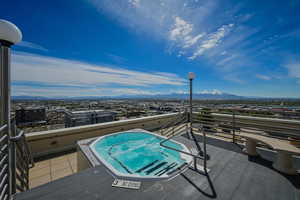 Rooftop hot tub with mountain views.