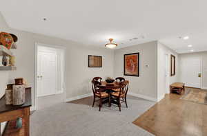 View of carpeted large dining space.