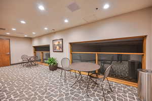 2nd floor seating area overlooking community racquetball courts.