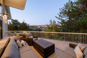 Wooden deck featuring an outdoor living space