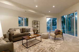 Living room featuring light colored carpet