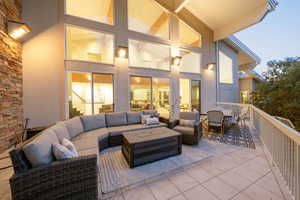 Patio terrace at dusk with outdoor lounge area