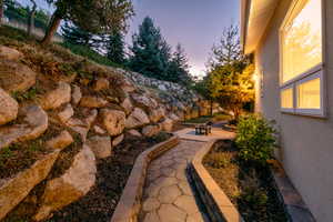 Yard at dusk with a patio