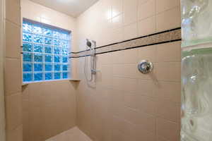 Bathroom with a tile shower