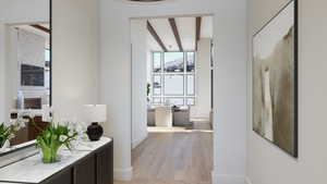 Corridor featuring beamed ceiling and light hardwood / wood-style floors