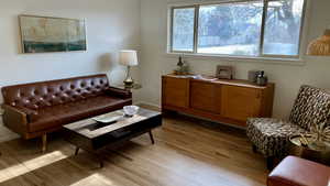 Living room with light hardwood / wood-style flooring