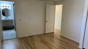 Unfurnished bedroom featuring light hardwood / wood-style flooring