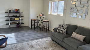 Living room with hardwood / wood-style flooring