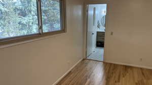 Corridor featuring light hardwood / wood-style flooring