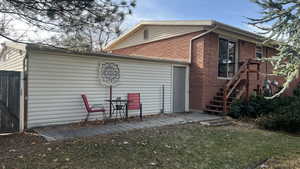 Back of house featuring a lawn