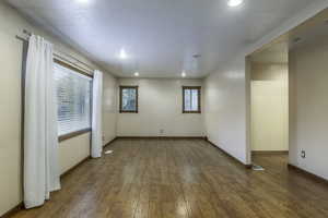 Unfurnished room with hardwood / wood-style floors