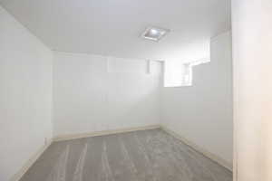 Unfurnished room with light colored carpet