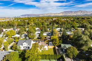 Birds eye view of property with a mountain view