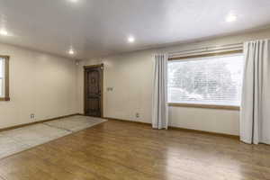 Empty room featuring light wood-type flooring