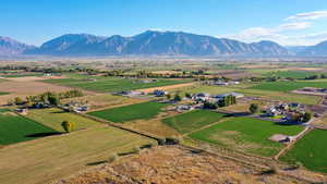 Drone / aerial view with a mountain view and a rural view