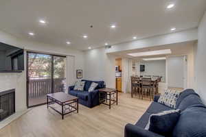 Living room featuring a fireplace and light hardwood / wood-style floors