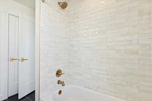 Secondary Bathroom with tiled shower / bath