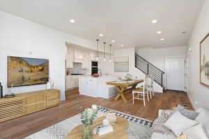 Living room and kitchen with wood flooring