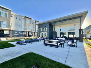 View of community with an outdoor living space and a patio area