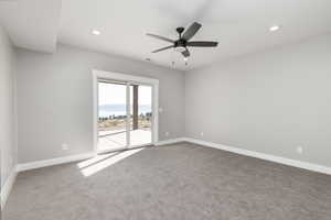 Bedroom featuring ceiling fan, closet, and carpet floors