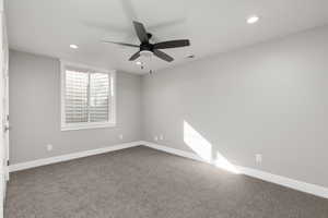 Bedroom featuring ceiling fan, closet, and carpet floors