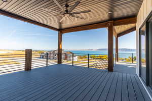 Trex deck with a water and mountain view and ceiling fan