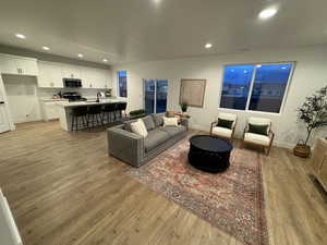 Living room featuring light hardwood / wood-style flooring and sink