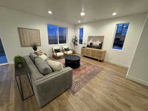 Living room with wood-type flooring