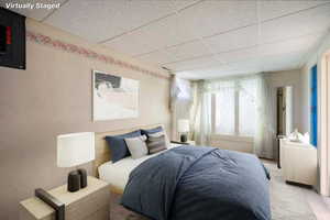 Virtually Staged - Bedroom with a paneled ceiling