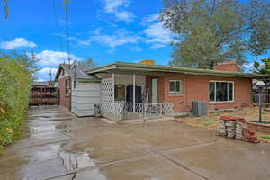 Rear view of property with central air condition unit