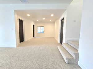 Downstairs living area attached to family room flex space