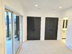Carpeted spare room featuring a mountain view and jack and jill bathroom